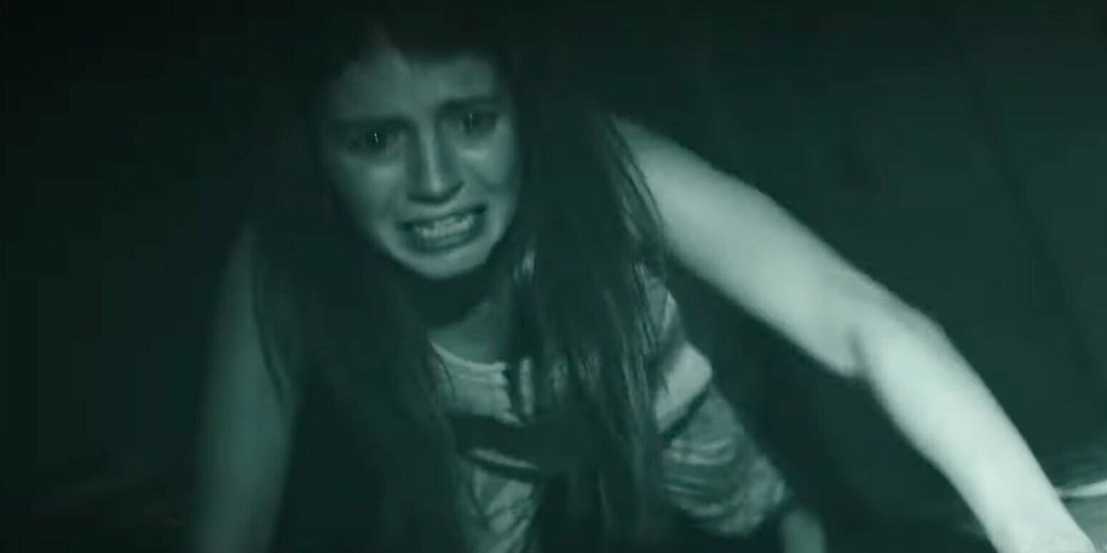 A woman screaming and scared in Paranormal Activity: Next Of Kin