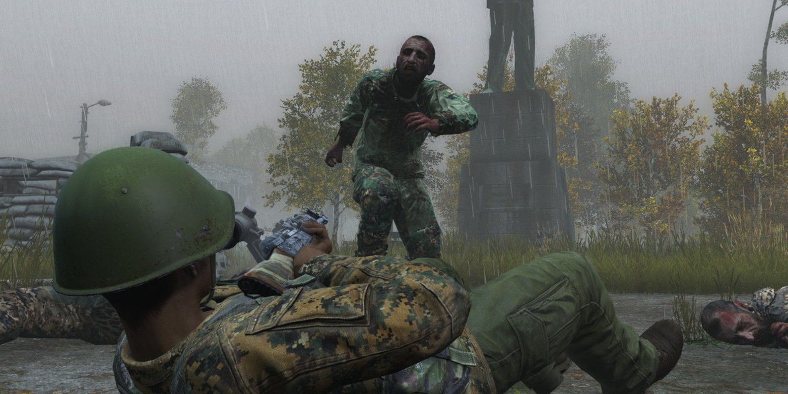 Soldier lying down and point gun at approaching zombie in DayZ